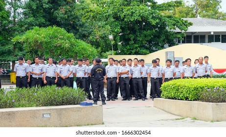 Morning Briefing Of Employees Fire Department In Hua Hin.
Row Of Firemen In Municipal Uniform At Staff Meeting Listening To Boss Before Working Day Next To Fire Station.Hua Hin,Thailand, July 2016