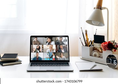 Morning Business Meeting Online. Video Conference By Laptop. On The Laptop Screen, People Who Gathered In A Video Conference To Work On-line. The Laptop Is On  The Workplace At Home