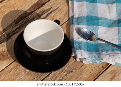 Morning Coffee With Blue Tea Towel And Iron Spoon On Wooden Table