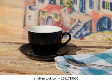 Morning Coffee With Blue Tea Towel And Iron Spoon On Wooden Table