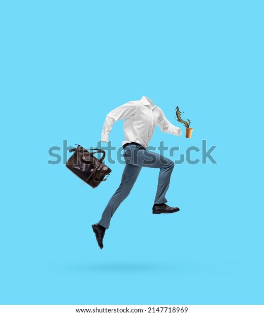 Morning coffee. Portrait of invisible man\
wearing modern business style outfit running, jumping isolated on\
blue background. Concept of fashion, creativity, art and ad.\
Invisible being.\
Contemporary