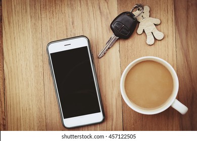Morning coffee and smart phone and car key