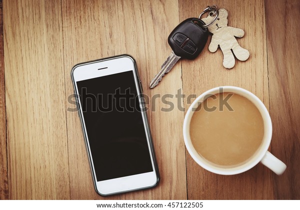 Morning coffee and\
smart phone and car key