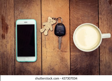 Morning coffee and smartphone and car key