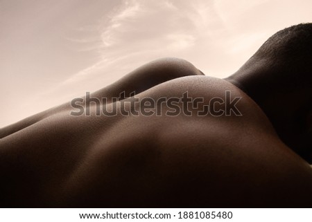 Morning. Detailed texture of human skin. Close up of young african-american male body surface like landscape with the sky on background. Skincare, bodycare, healthcare, inspiration, fantasy artwork.