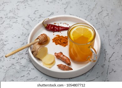 morning detox drink turmeric in the glass on a gray concrete background. copy space - Powered by Shutterstock