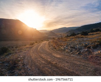 Morning dirt road through the mountain plateau.