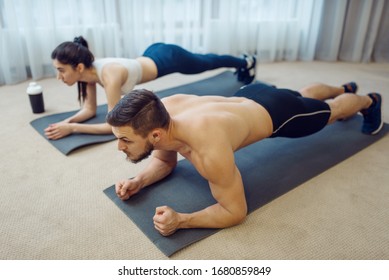 Morning Fitness Workout Of Family Couple At Home