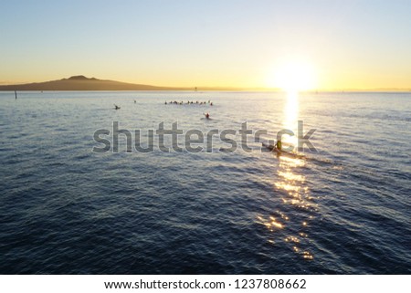 Morning Glory. Rowing towards the Sun. Photo taking in Auckland and facing Rangitoto Island.