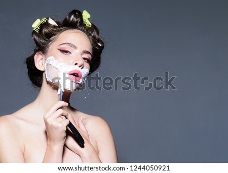 morning grooming and skincare. pinup girl with fashion hair. retro woman shaving with foam and razor blade. pin up woman with trendy makeup. pretty girl in vintage style, copy space. hairdresser.