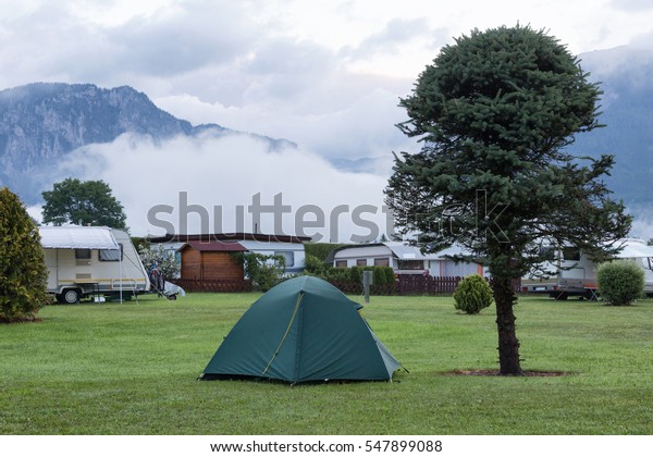 Morning landscape\
with a camping in\
mountains
