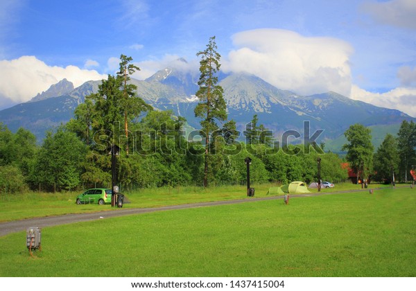 Morning landscape with a camping in mountains of High\
Tatras, Slovakia .