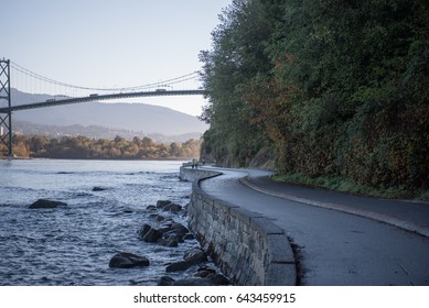 Morning Light Cascades Over The Stanley Park Sea Wall In Vancouver, BC.