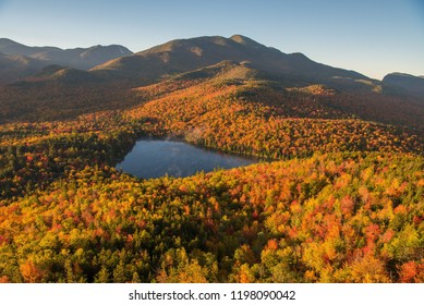 Morning light illuminates the fall color in the Adirondack mountains