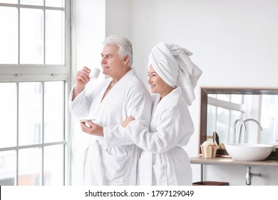 Morning of mature couple in bathroom - Powered by Shutterstock