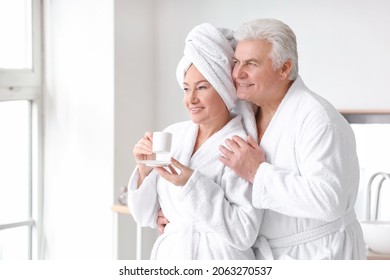 Morning of mature couple in bathroom - Powered by Shutterstock