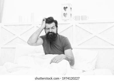 Morning Migraine. Tired Bearded Man In Bed. Early Wake Up At Morning. Bachelor Has Hangover. Guy At Bedroom. Lazy Sunday. Bed Time Routine. Brutal Male Wake Up With Headache. Relax Lifestyle Concept