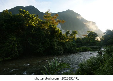 Morning Mist Over The Melinau River With Mount Benarat, Mulu, Sarawak, Borneo