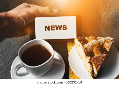 Morning news, breakfast. Coffee and cakes, pie. - Shutterstock ID 560231734