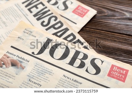 Morning newspapers on wooden background