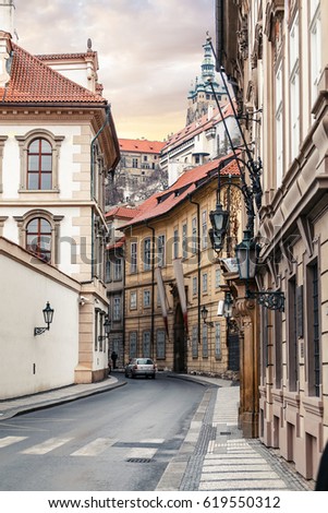 Morning in old city narrow street without people and cars in Prague.