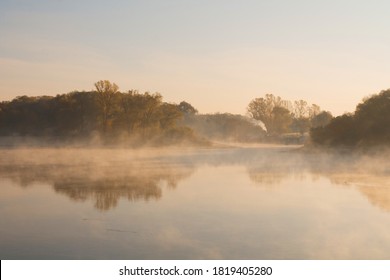 Morning on the river early morning reeds mist fog and water surface on the river - Powered by Shutterstock