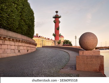 Morning On The Spit Of Vasilievsky Island. View Of The Rostral Column, Granite Parapet With A Stone Ball On The Embankment