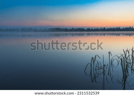 Similar – Morgensonne scheint auf den Dunst über einem See