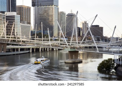 Morning Over Water View Of Brisbane, Australia, Queensland, Cityscape With River, Bridge And River Transport