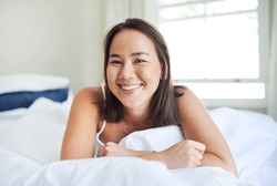 Morning, Portrait And Asian Woman Wake Up In Bed On Holiday Or Relax Vacation With Happiness From Nap. Healthy, Rest And Girl With Energy Ready To Start Weekend In Singapore With Wellness In Home