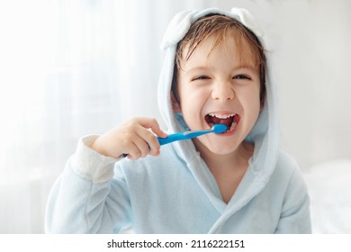 Morning Routine, Smiling Happy Child Brushing Teeth With Toothbrush. Dental Hygiene Of Little Boy, Medical Care.