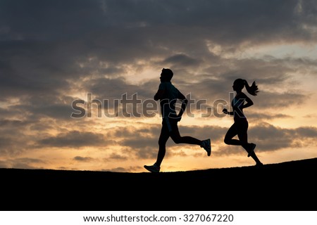 Morning running. Running athletes. Silhouette of runner on evening scamper.