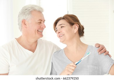 Morning of senior couple in bathroom - Powered by Shutterstock