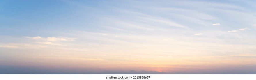 The morning sky looked like a bright golden sky. The sunrise is decorated with clouds in various shapes. Looks beautiful. - Shutterstock ID 2013938657