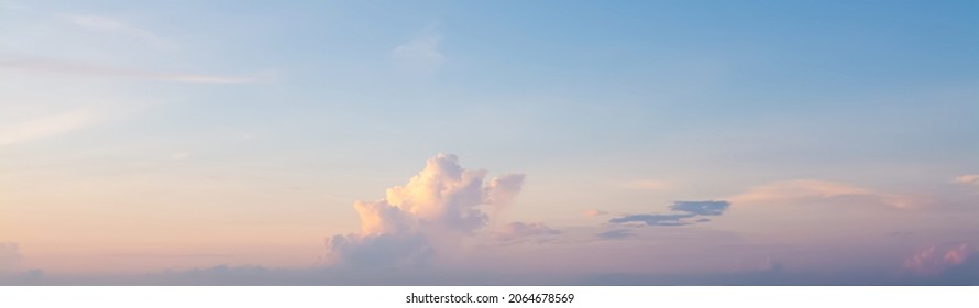 The morning sky looked like a bright golden sky. The sunrise is decorated with clouds in various shapes. Looks beautiful. - Shutterstock ID 2064678569