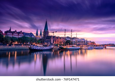 Morning Skyline of  Bremen Old Town as seen over Weser river. Long exposure, artistic filters applied
