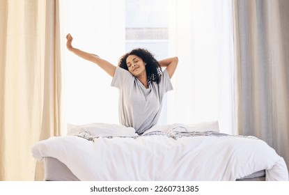 Morning stretching, black woman and wake up in home bedroom after sleeping or resting. Relax, peace and comfort of happy female stretch after sleep feeling fresh, awake and well rested in house. - Powered by Shutterstock