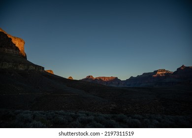 Morning Sun Begins To Highlight Surrounding Canyon Rim From The Tonta Plateau In The Grand Canyon