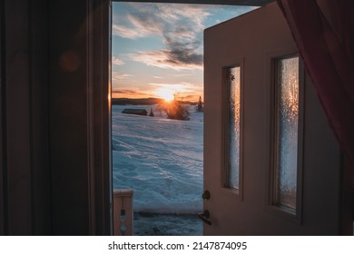 The Morning Sun Breaking Through The Opened Door Of A Cozy Cottage In Sweden Jämtland (Lapland).