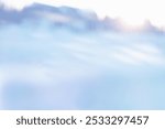 MORNING SUN RISE IN THE SNOWY MOUNTAIN LANDSCAPE, WINTER HILLS BACKGROUND, BLURRY WINTER SLOPE BACKDROP