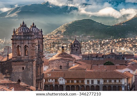 Morning sun rising with cloudy on Aden Mountain at Plaza de armas, Cusco, Peru