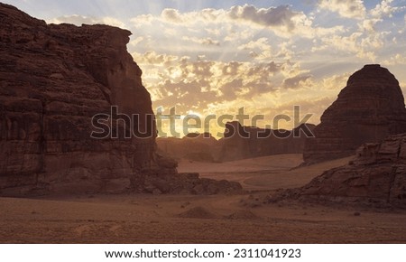 Morning sun shines over rocky desert formations, typical landscape in Al Ula, Saudi Arabia