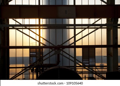 morning sunlight shining through large factory windows