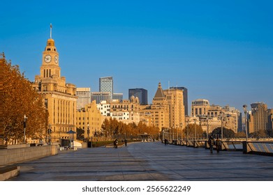 Morning sunrise of Historical architecture on the bund of Shanghai with reflection of buildings in city Shanghai, China