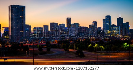 Morning Sunrise in the Mile High City of Denver , Colorado , USA golden hour Traffic and gorgeous sunshine panoramic panorama entire horizon skyline cityscape time lapse golden hour