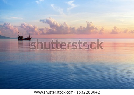 Morning sunrise pink sky, blue sea, white clouds, ship silhouette, scenery landscape, soft color sunset on ocean coast, beautiful seascape, boat and sun reflection on water, Thailand, Koh Samui island