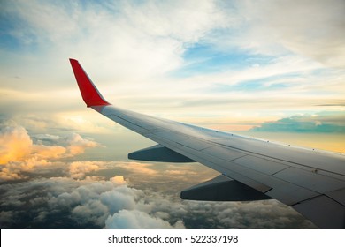 Morning sunrise with Wing of an airplane. Photo applied to tourism operators. picture for add text message or frame website. Traveling concept
