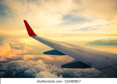 Morning sunrise with Wing of an airplane. Photo applied to tourism operators. picture for add text message or frame website. Traveling concept
