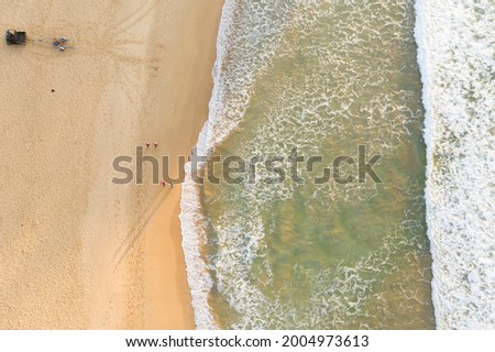 Similar – Aerial View From Flying Drone Of People Crowd Relaxing On Algarve Beach In Portugal