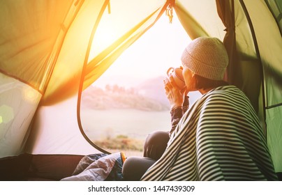 Morning In Temt Camp.Woman With Cup Of Hot Tea Sit In Camping Tent